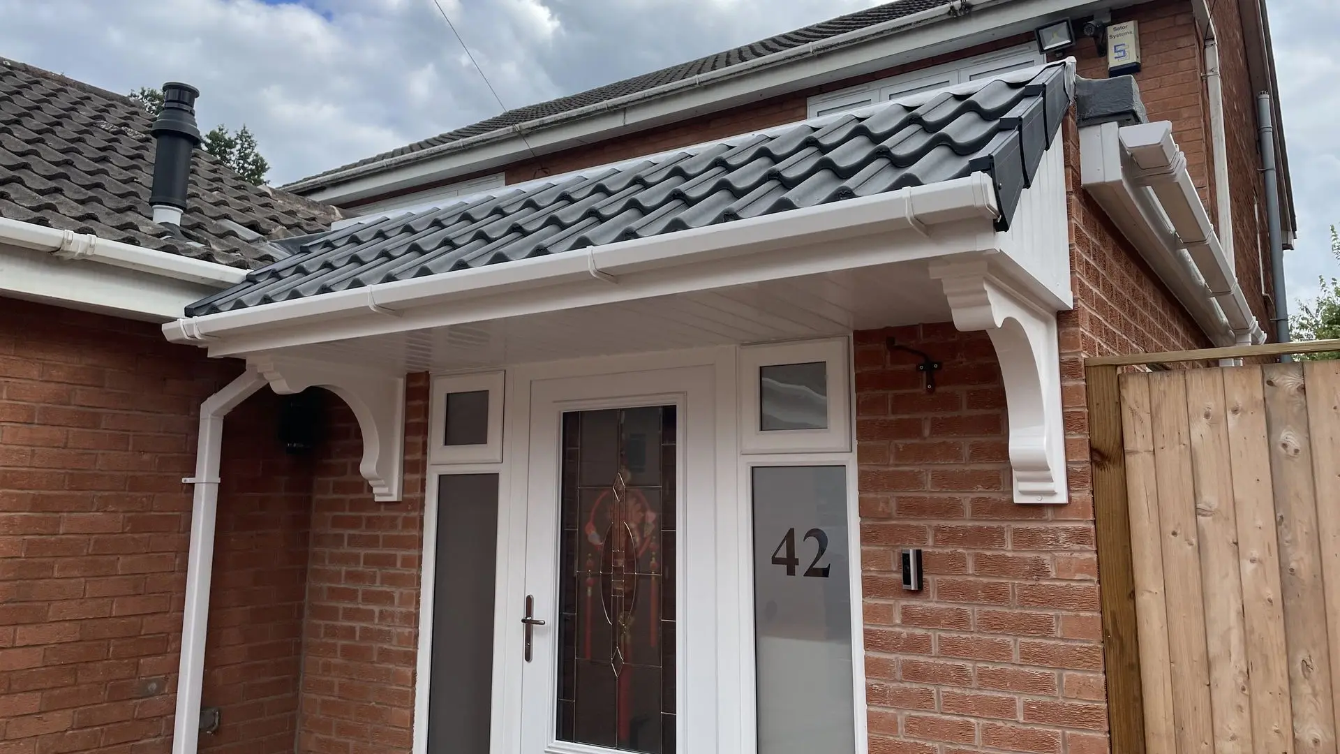 Stunning 3m Door Canopy Installation with Grey Wavy Tiles on a Bungalow Property